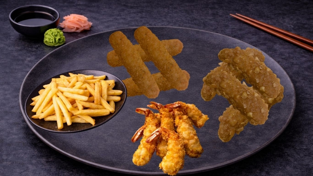 Kyllingnuggets 4 stk, mozzarella 4 stk, scampi 5 stk, pommes fritert 200 gr, med hvitløk dressing.